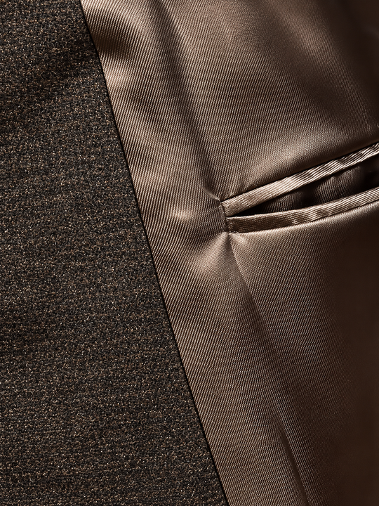 Brun kviltet outdoorvest i uld med småt houndstooth-mønster – by David K