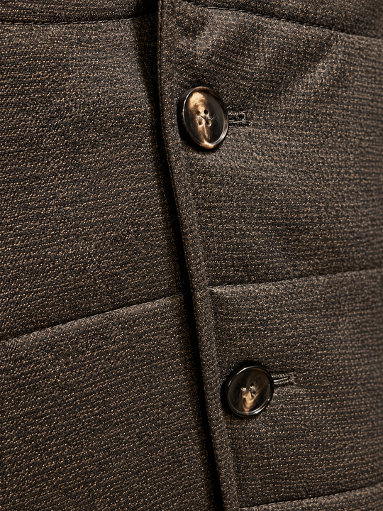 Brun kviltet outdoorvest i uld med småt houndstooth-mønster – by David K