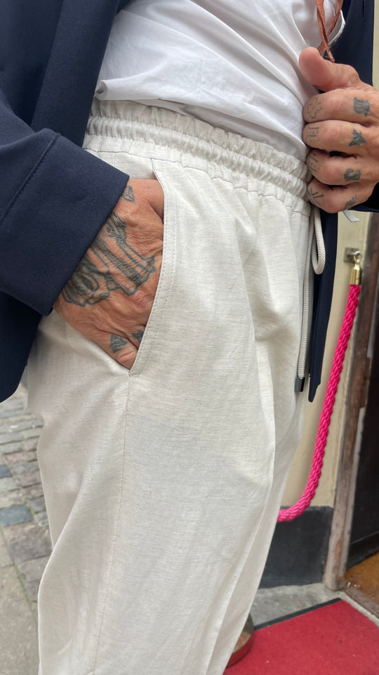 Light linen trousers with drawstring closure