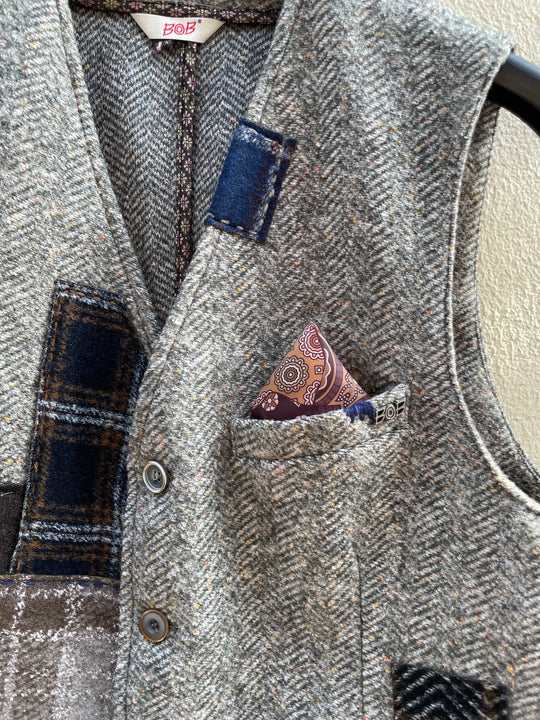Grøn vest med sildeben og patchwork