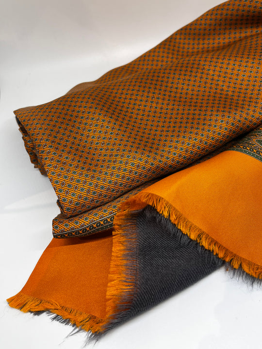 Orange wool/silk scarf in a birdseye pattern
